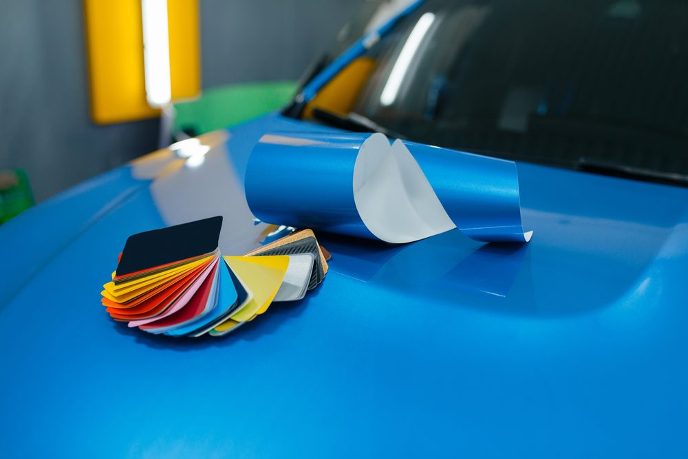 A colour swatch held against a freshly wrapped hood